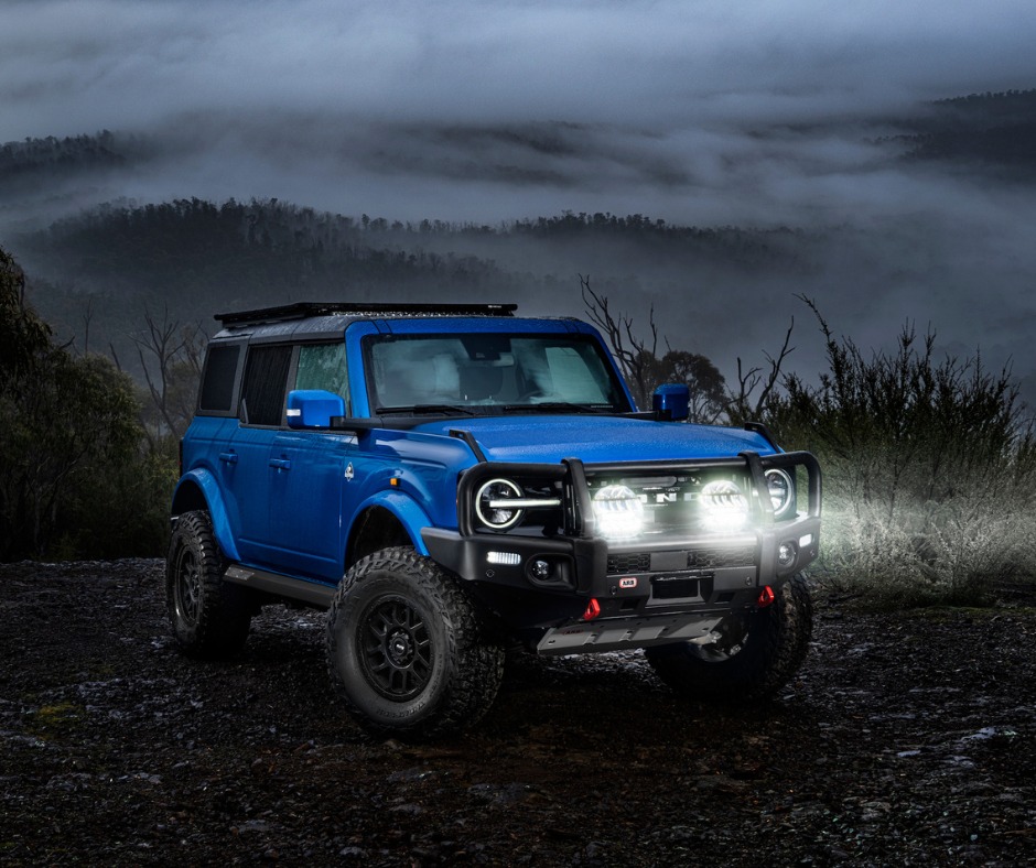 blue car in misty dark outdoor area
