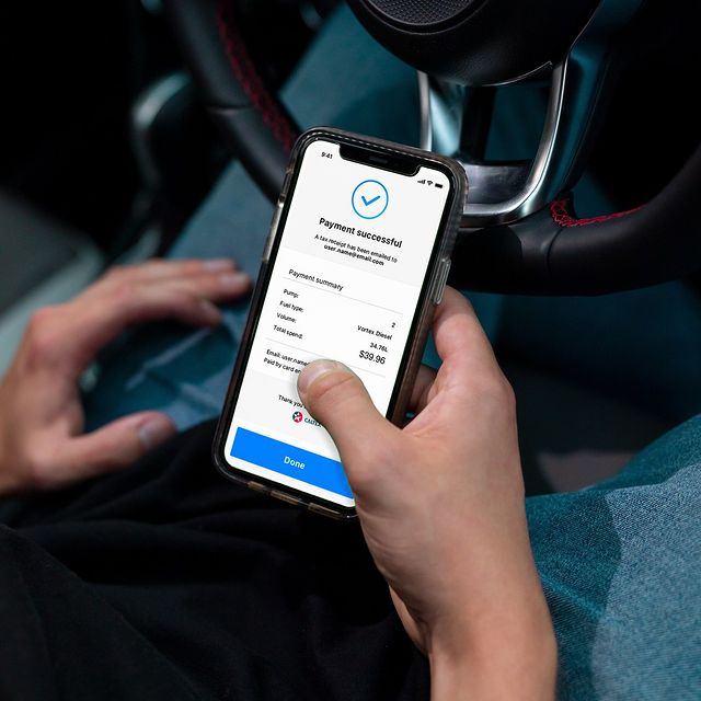 caltex starcard app holding iphone in car
